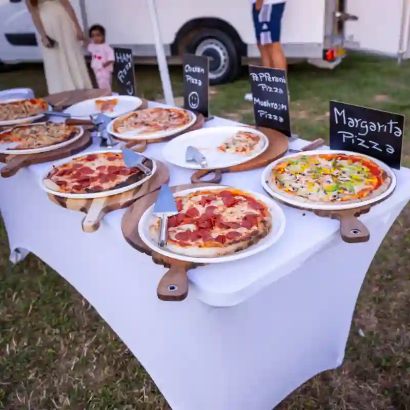 Many pizzas on a table